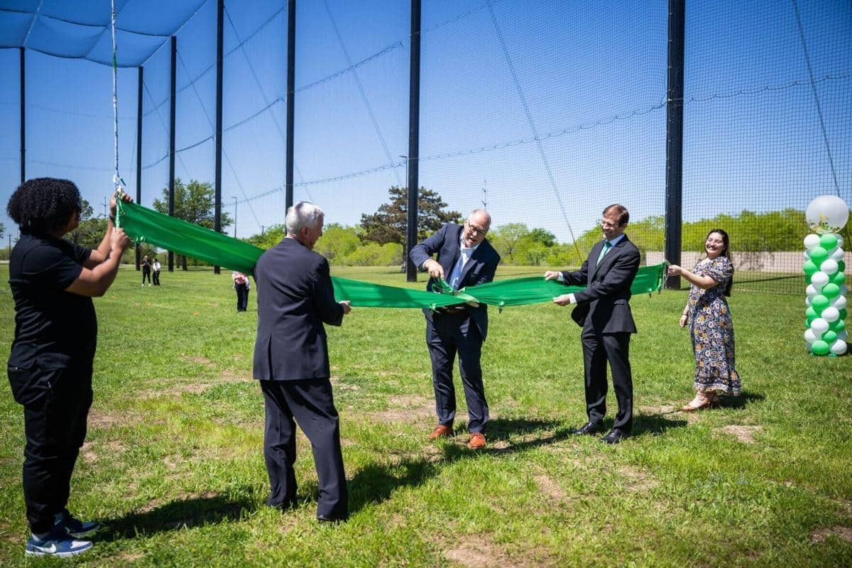 University Of North Texas President Neal Smatresk Officially Opens The New Drone Testing Facility At Discovery Park By Cutting The Ceremonial Green Ribbon During Thursday'S Inauguration Event. Image Credit: Pete Comparoni, Unt (Courtesy Photo)