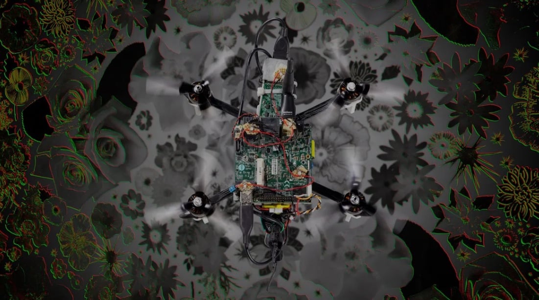 An Image Of The &Quot;Neuromorphic Drone&Quot; Flying Above A Flower Pattern. Delft University Of Technology