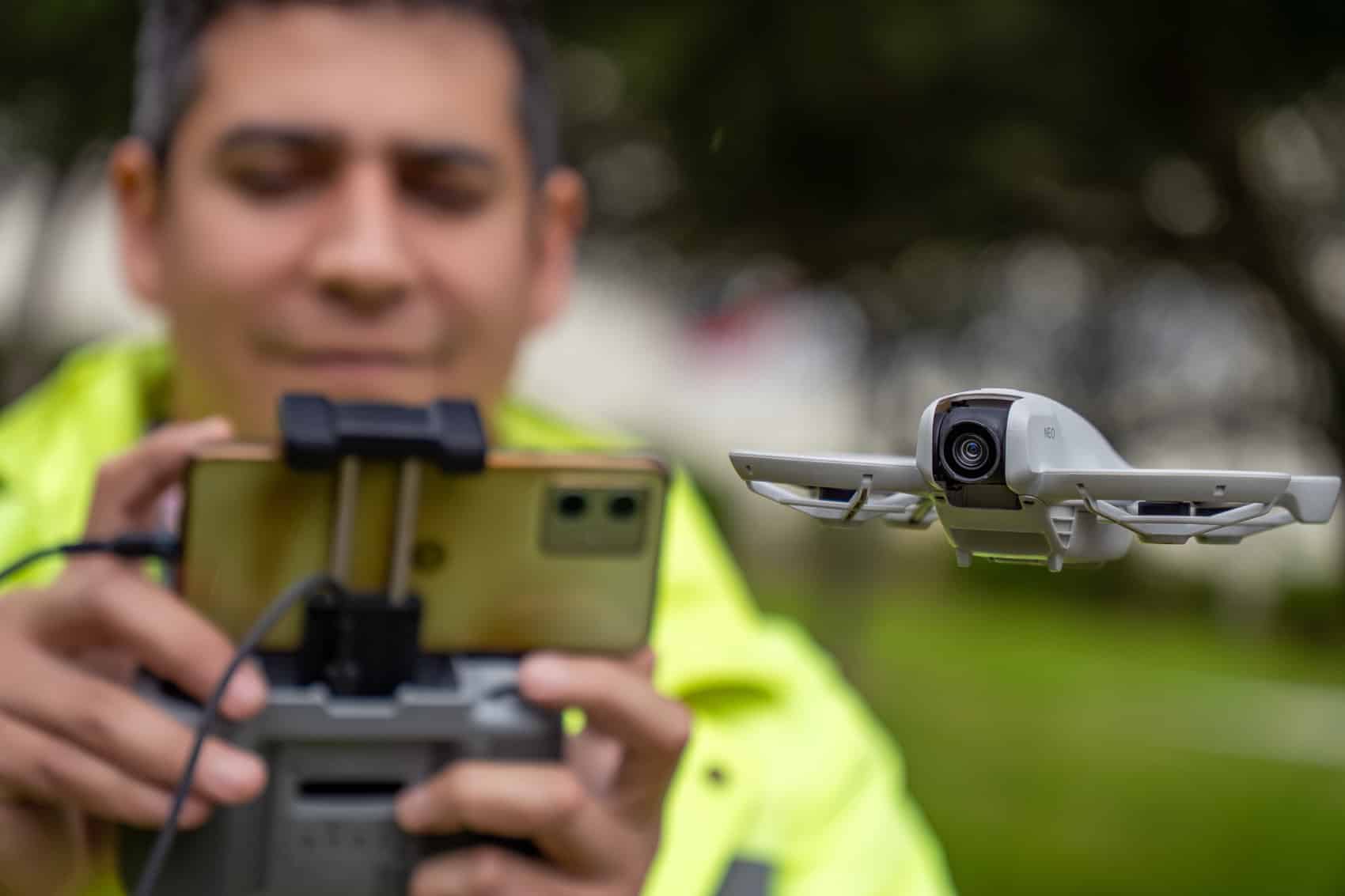 Man flying a Dji Neo with a RC-N3 controller