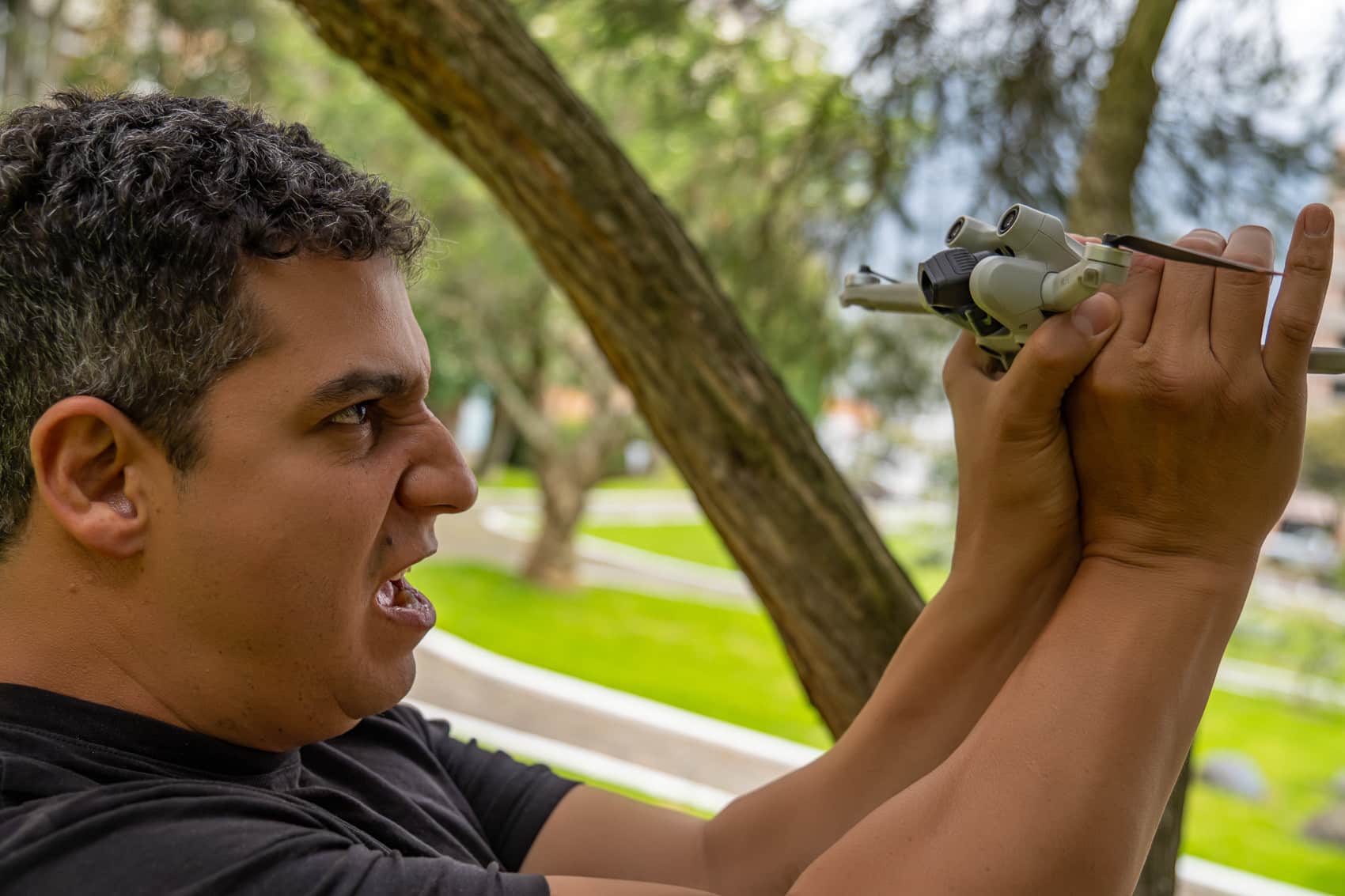 Man fighting a mini 3 pro drone