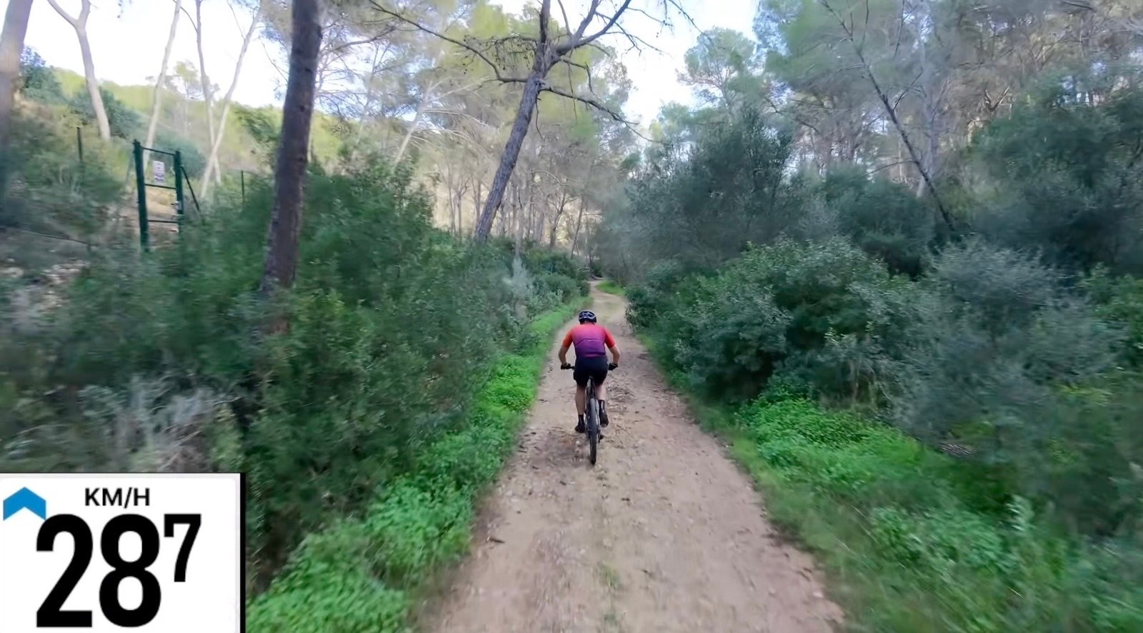Cyclist On A Dirt Trail Outdoors. Dji Neo 2 Gauntlet Test: From Tight Trails To Abandoned Resorts At 48 Km/H