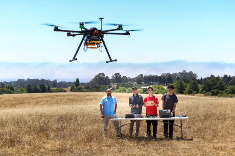 Javier Gonzalez-Rocha, Ucsc Professor Photo With Uc Santa Cruz Students Observing Their Air Quality Sensing Drone | Photo Credits: Ucsc